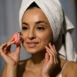 Smart Home Devices Skincare Tips – woman using a facial skincare device with a towel wrapped around her head for a modern beauty routine