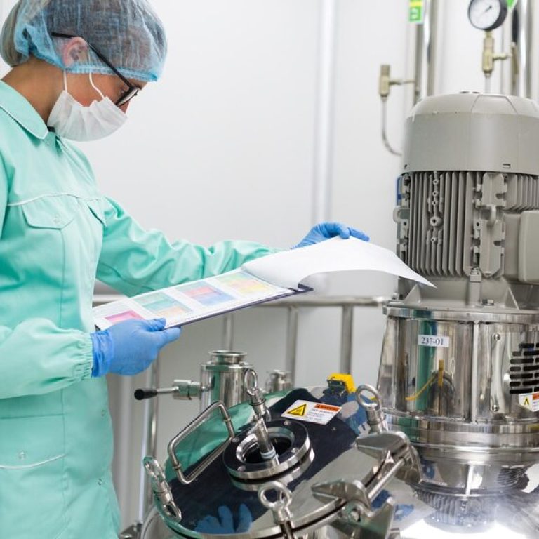 factory-worker-blue-suit-is-checking-readings-compressor_645730-41